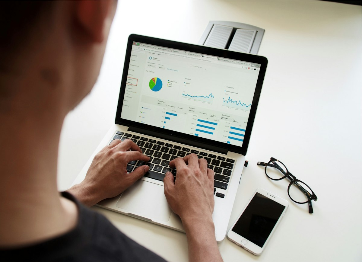 Analyst reviewing a data dashboard on a laptop
